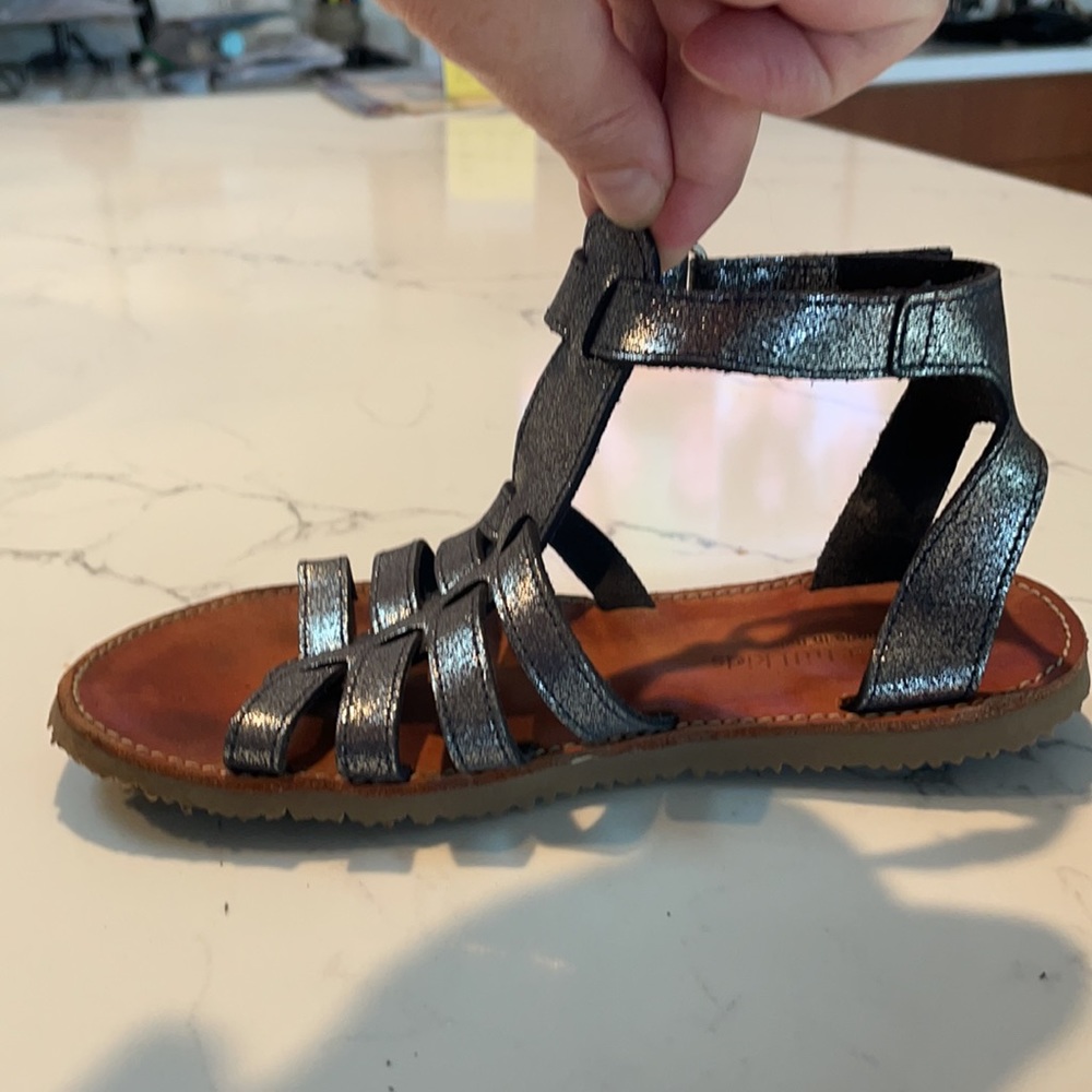 Metallic blue leather gladiator sandals